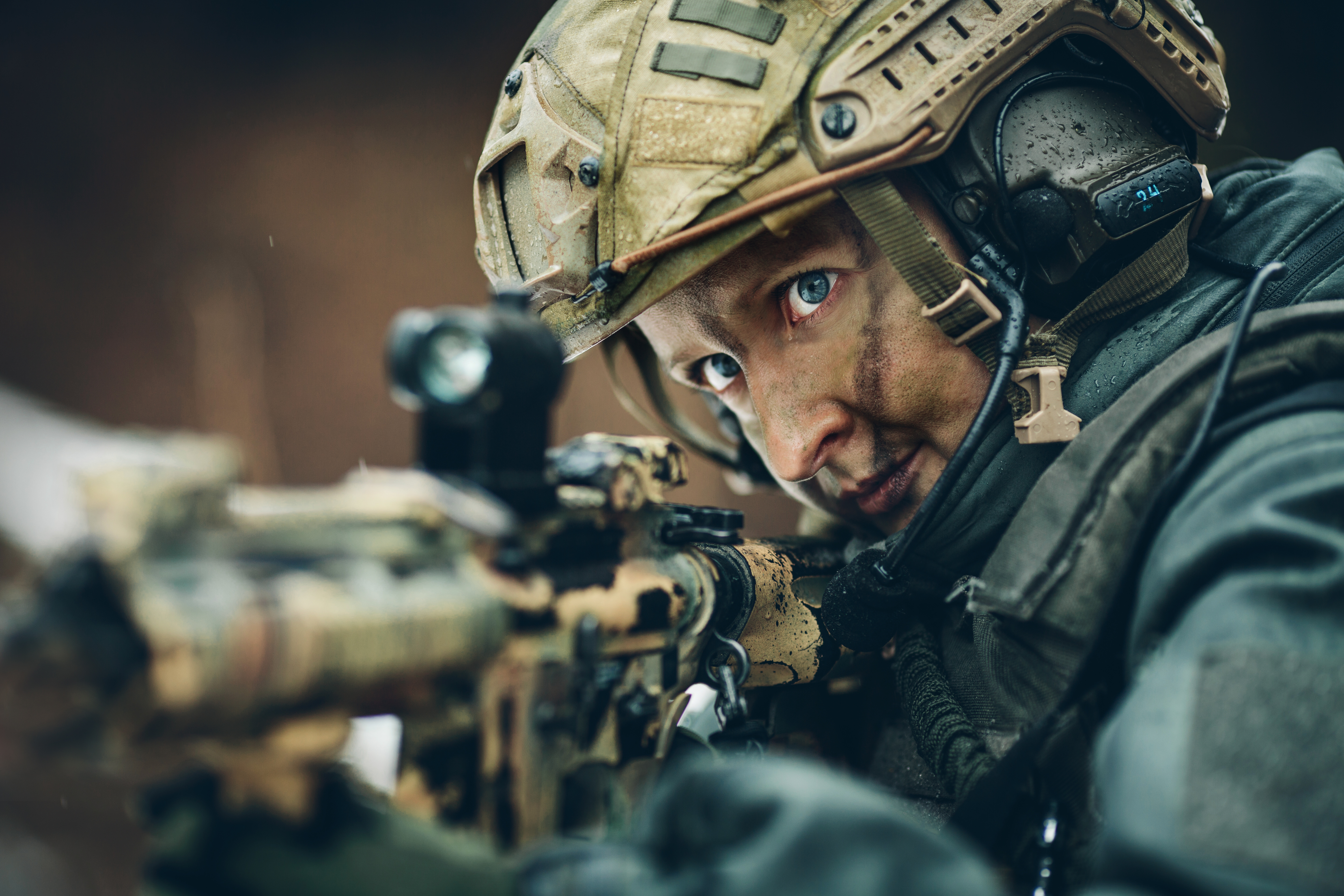 armed  woman in camouflage with sniper gun
